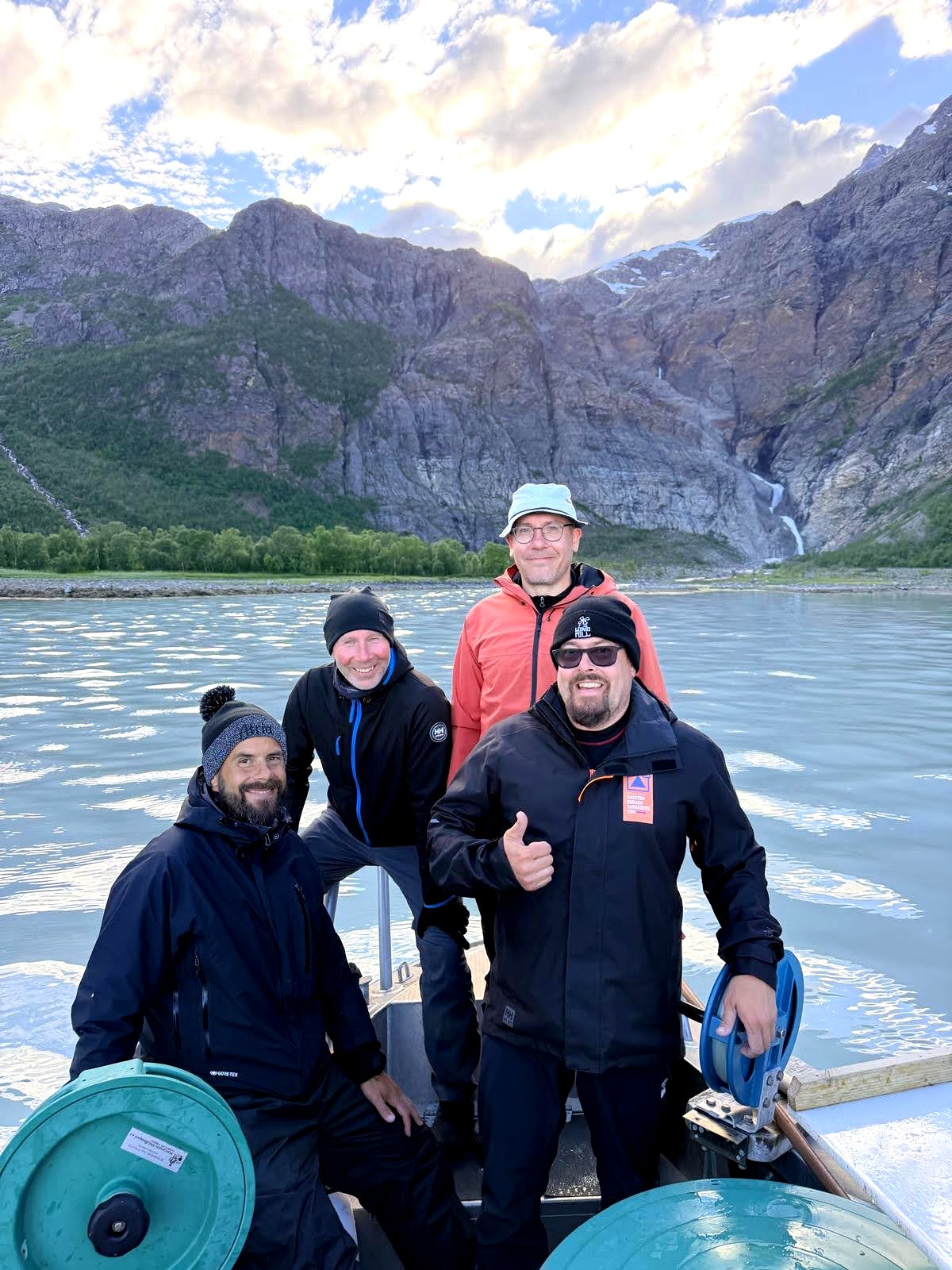 Guide and guests together on the boat under open skies